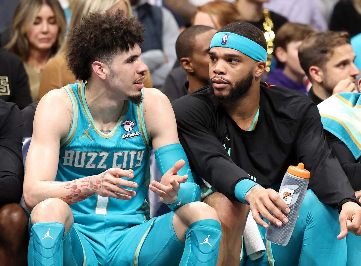 Charlotte Hornets guard LaMelo Ball, left, talks with forward Miles Bridges, right, during first-half action against the Milwaukee Bucks on Friday, November 17, 2023 at Spectrum Center in Charlotte, NC. Ball had 37 points and Bridges had 17, but the Hornets lost by 31 points.