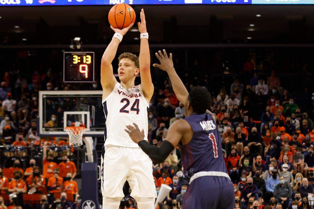 Igor Milicic Jr. (24), a member of the Virginia Cavaliers, shoots the ball on Dec. 18, 2021, in Charlottesville, Va., at John Paul Jones Arena.