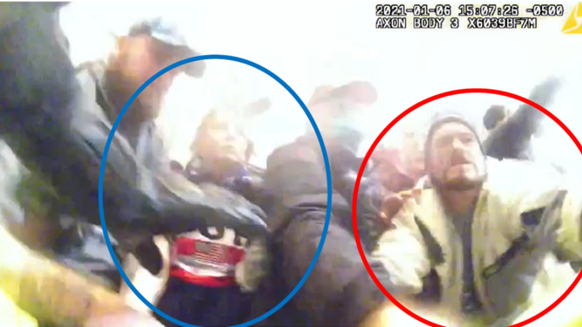 Tanya Bishop and Curtis Davis lunge at police during the Capitol riots on Jan. 6, 2021. The couple now faces felony and misdemeanor charges.