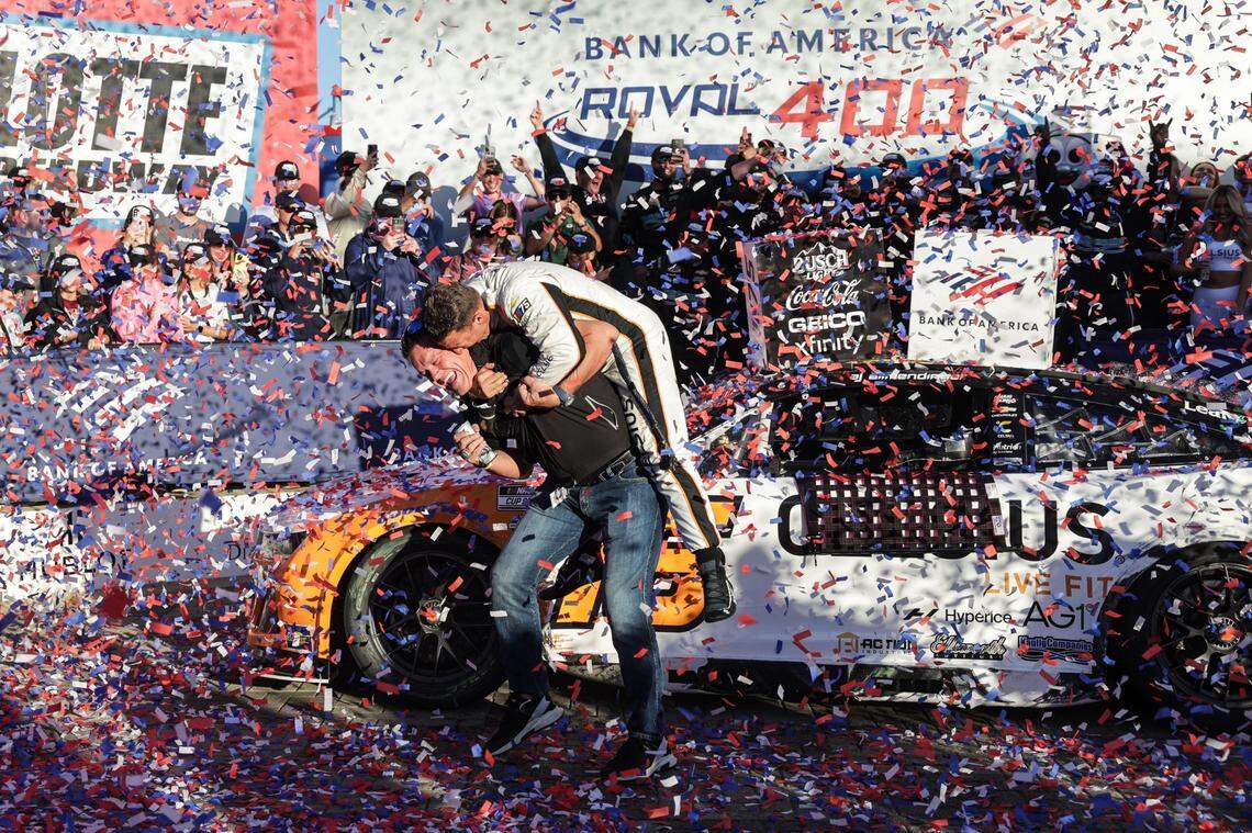 AJ Allmendinger, right, jumps on top of Kaulig Racing owner Matt Kaulig as they celebrate Allmendinger’s win in the 2023 Roval 400 at Charlotte Motor Speedway.