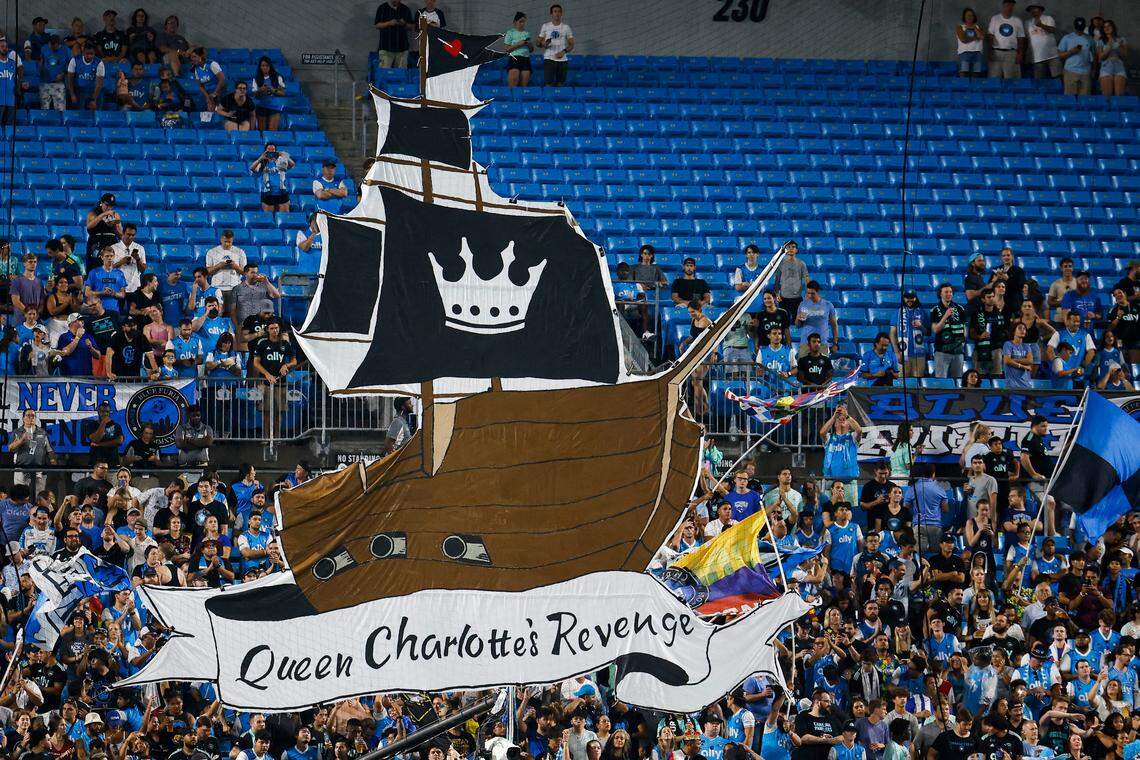 Charlotte FC fans hold a giant sign behind the home goal during a game between Charlotte FC an Columbus Crew at Bank of America Stadium in Charlotte, N.C., Saturday, July 30, 2022.
