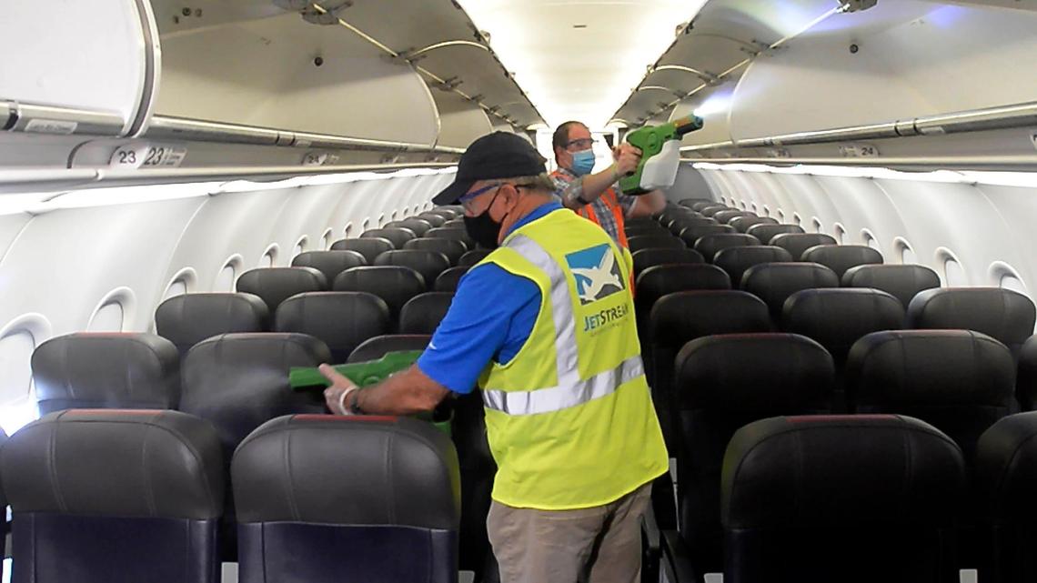 Airplane cleaners use electrostatic cleaning devices to process the cabin area of an American Airlines jet during the turnaround phase of the plane at Charlotte Douglas International Airport on Tuesday, June 30, 2020. American Airlines , the dominant air carrier at the airport, invited the media to watch an on-board demonstration of their aircraft cleaning process to show the expanded cleaning of the airplanes.