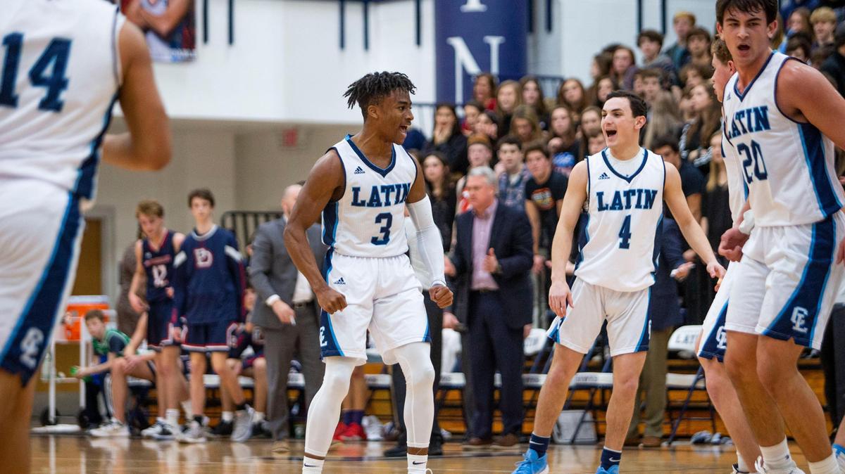 Charlotte Latin’s Randy Johnson cheers with his teammates after a standout second quarter that put the Hawks in the lead against Providence Day at Charlotte Latin in Charlotte, NC on Friday, February 7, 2020.