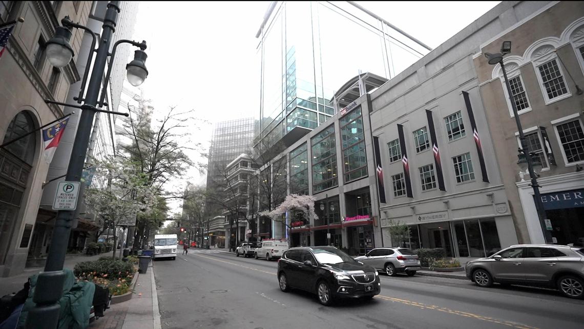 Light vehicular and pedestrian traffic defines uptown Charlotte in the wake of the coronavirus pandemic.