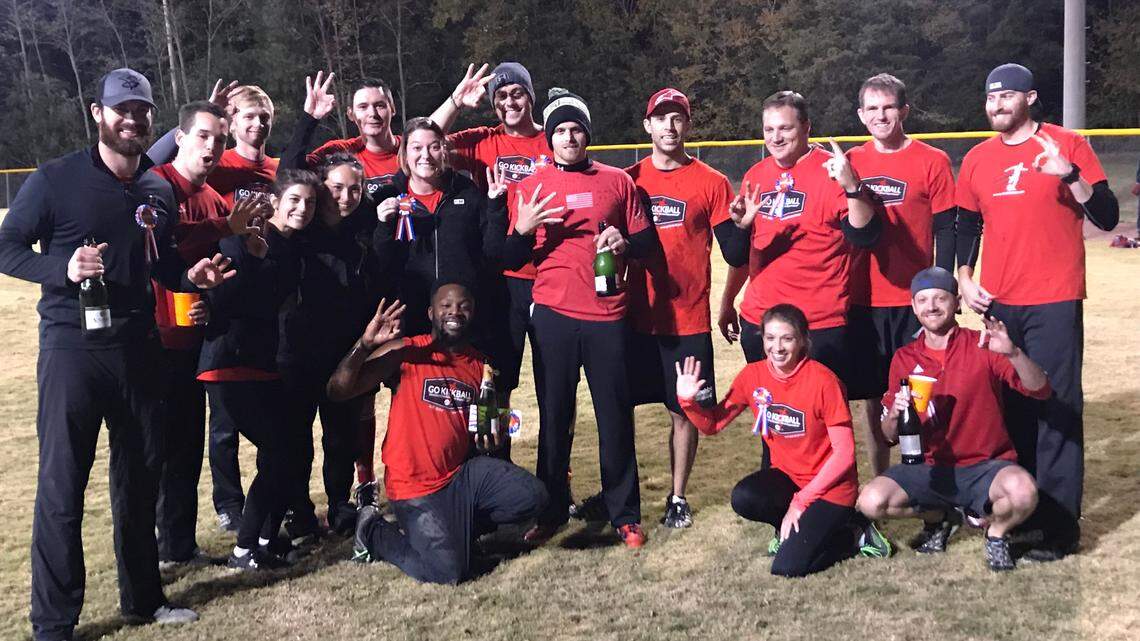 NASCAR Cup driver Corey LaJoie (far left) and Cup crew chief Cliff Daniels (top row, fourth from the right) pose with their co-ed kickball team after winning a tournament in the Charlotte area.