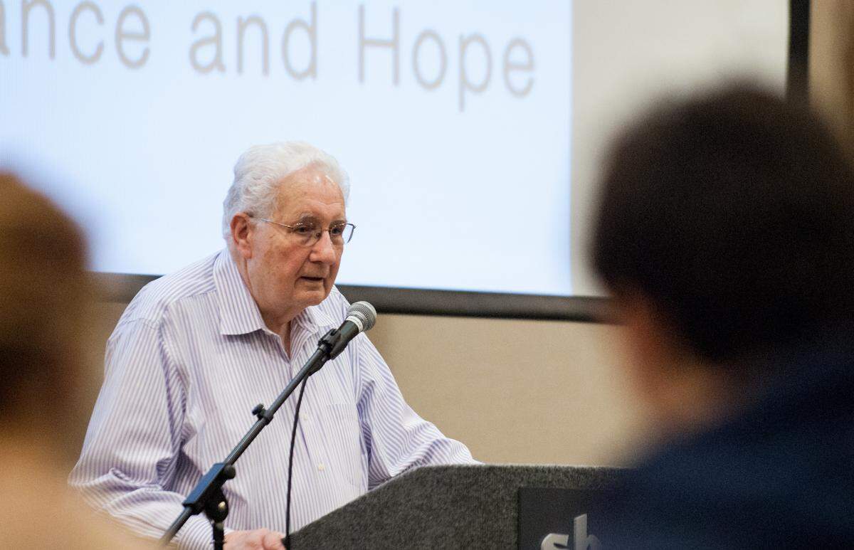 Holocaust survivor Irving Bienstock shares his story with children at Levine Jewish Community Park in Charlotte on April 16, 2015.