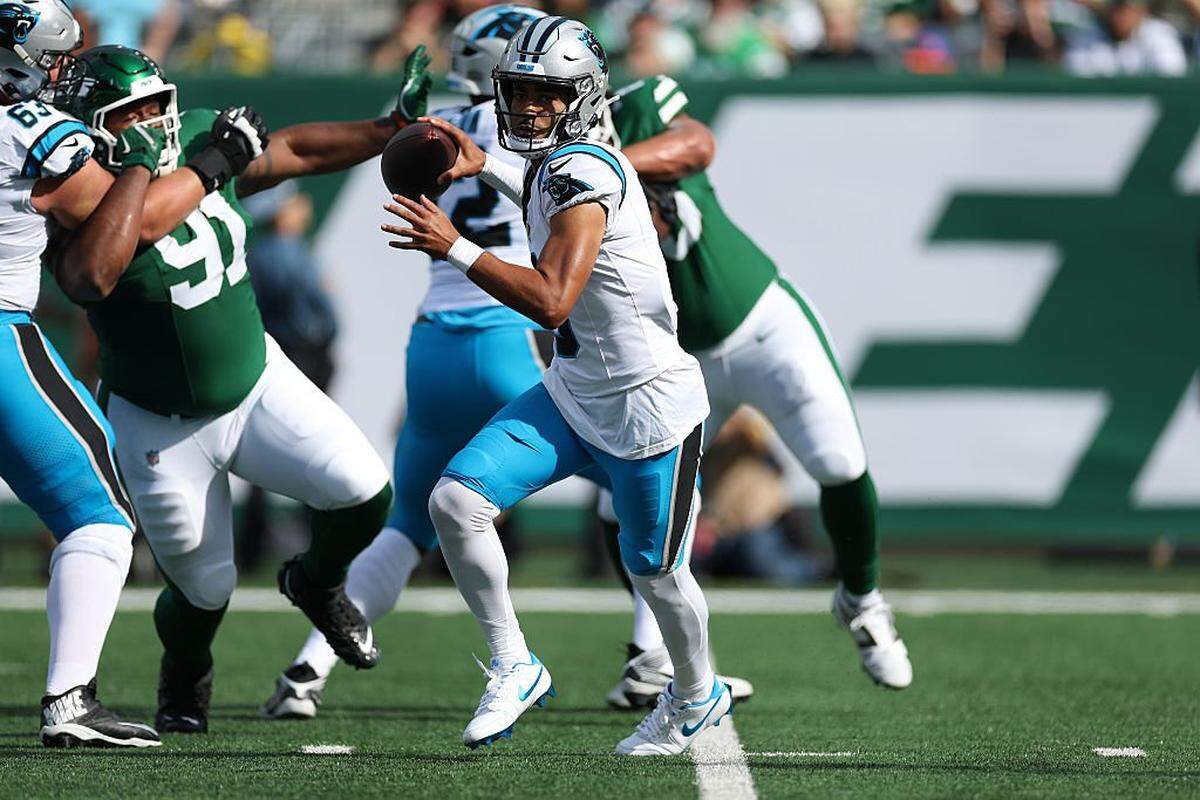 Quarterback Bryce Young (9) of the Carolina Panthers scrambles during the first quarter against the New York Jets in the game at MetLife Stadium on October 19, 2025 in East Rutherford, New Jersey.