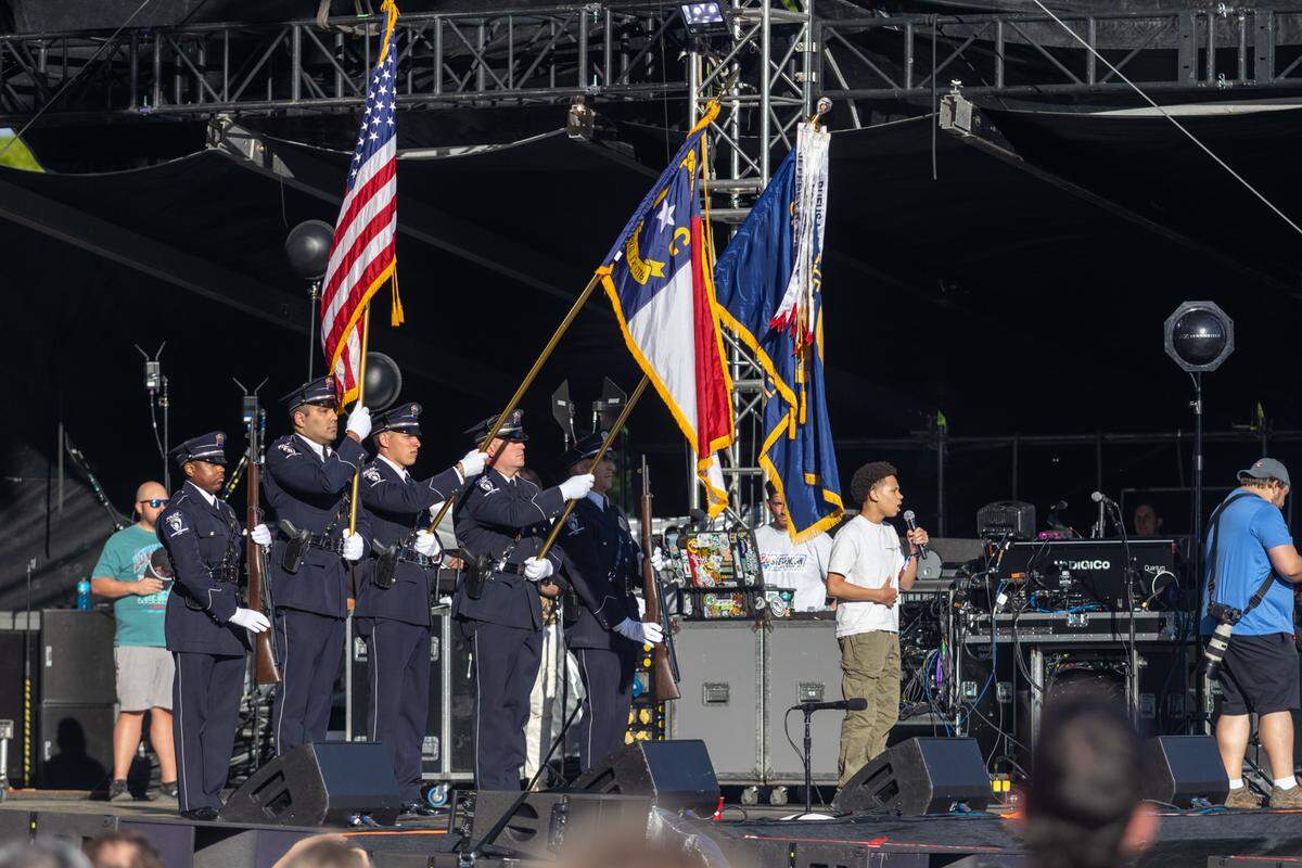 Local police officers on stage at Lovin’ Life Music Fest on Sunday, May 4, 2025.