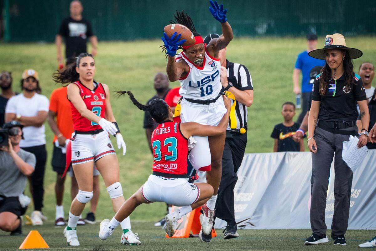Amber Clark dives toward the end zone in a flag football game with USA Football’s Women’s Flag National Team.