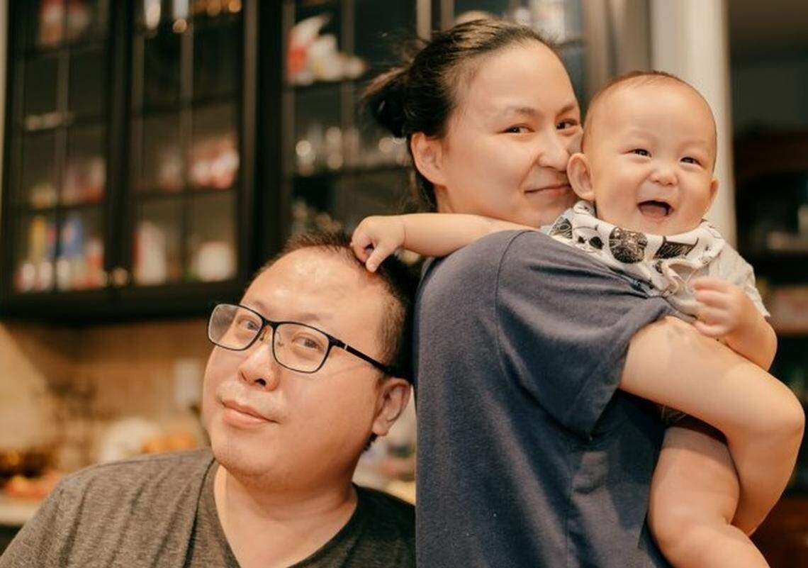 Linda and Ricky Kuai, shown with their 23-month-old son Lucas, are opening Beard Papa’s cream puff store in Charlotte.