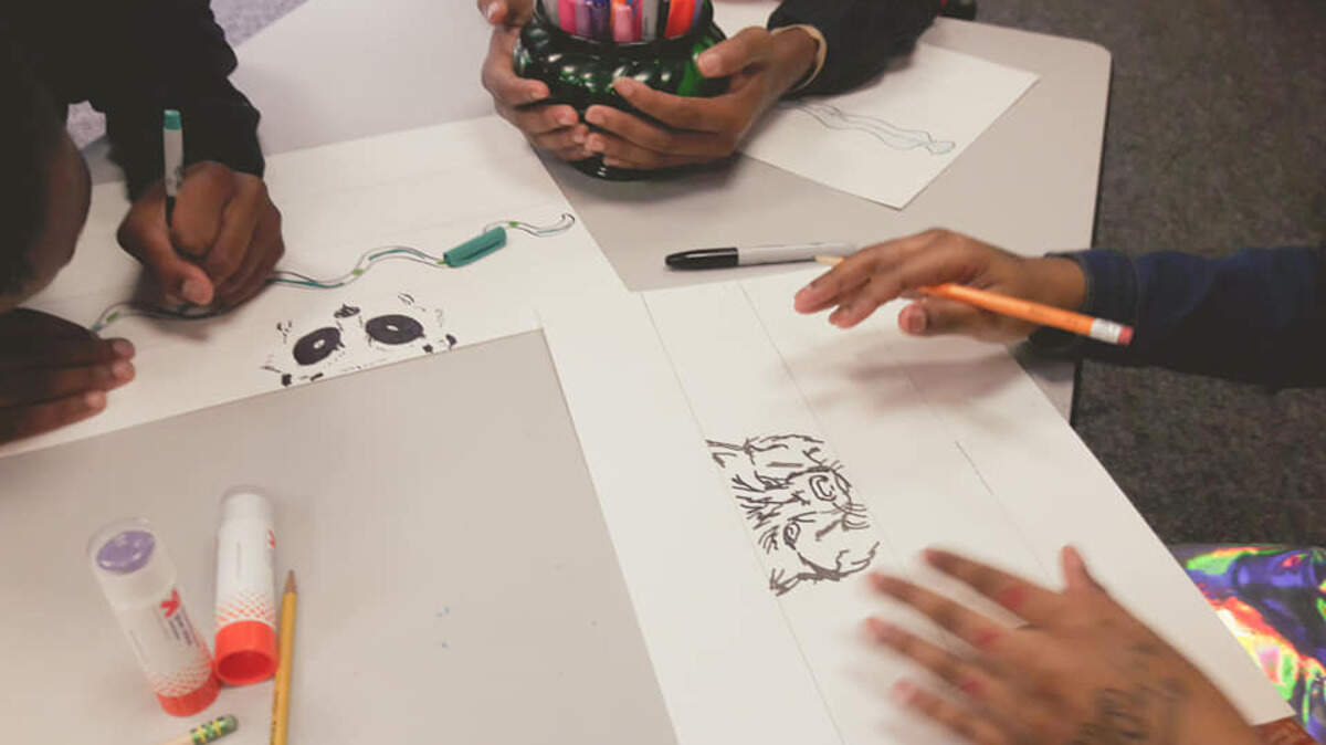 Guerilla Poets held an art workshop for students from TYM Inc. (Transforming Youth Movement) at the West Boulevard library branch in July 2019. Guerilla Poets’ workshops help kids, teens and adults use art to work through difficult emotions and experiences.