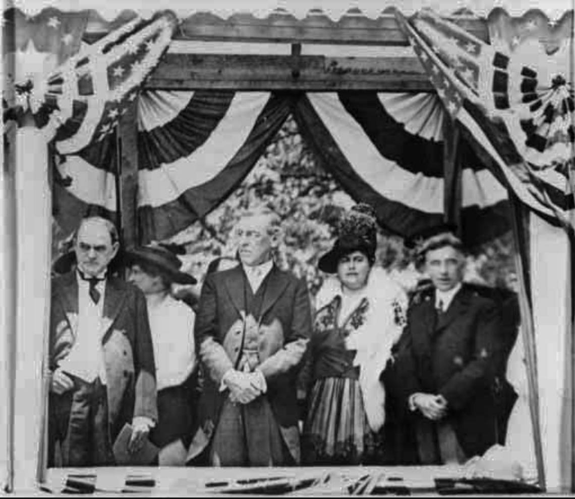 President Woodrow Wilson and first lady Edith Wilson in Charlotte on May 20, 1916, for the Mecklenburg Declaration of Independence celebration. Wilson’s father had enslaved Romare Bearden’s great-grandparents before the Civil War started. As president, Wilson segregated federal offices and fired all Black federal railway mail clerks, a job once held by Bearden’s great-grandfather.