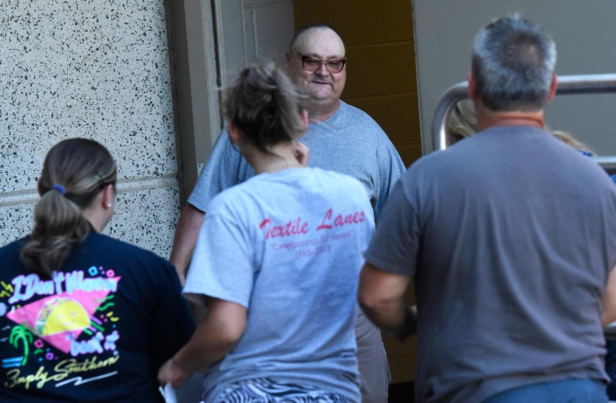 Mark Carver was greeted by his attorney Chris Mumma and family members outside the Gaston County Jail. Carver was released from prison on Tuesday after Superior Court Judge Christopher Bragg set aside Carver’s conviction for the murder of Ira Yarmolenko.