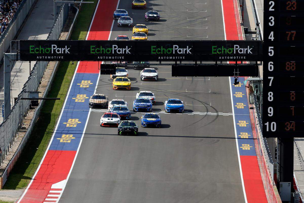 Mar 2, 2025; Austin, Texas, USA; NASCAR Cup Series driver Tyler Reddick (45) front, Bubba Wallace (23) left, and Chase Elliott (9) right are in the lead to start the race at Circuit of the Americas.