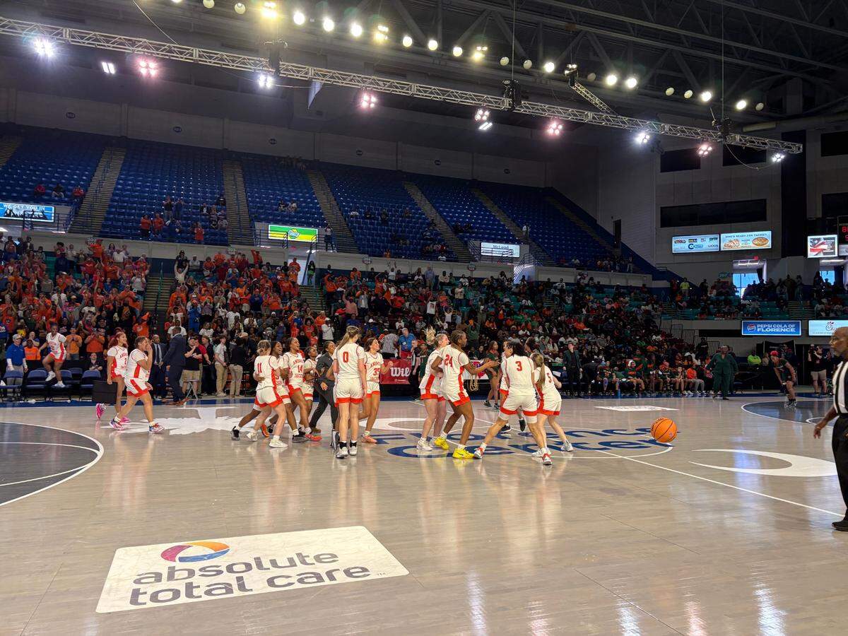 The Andrew Jackson girls’ basketball team celebrates as the buzzer sounds in their 89-36 win in the SCHSL 2A state championship Saturday in Florence.