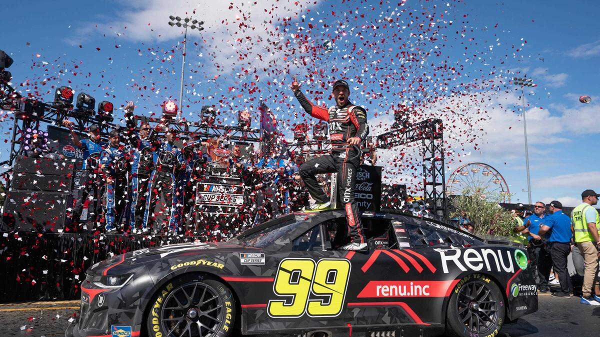 Jun 12, 2022; Sonoma, California, USA; NASCAR Cup Series driver Daniel Suarez (99) celebrates his win of the NASCAR Toyota - Save Mart 350 race event at Sonoma Raceway. Credit: Stan Szeto-USA TODAY Sports