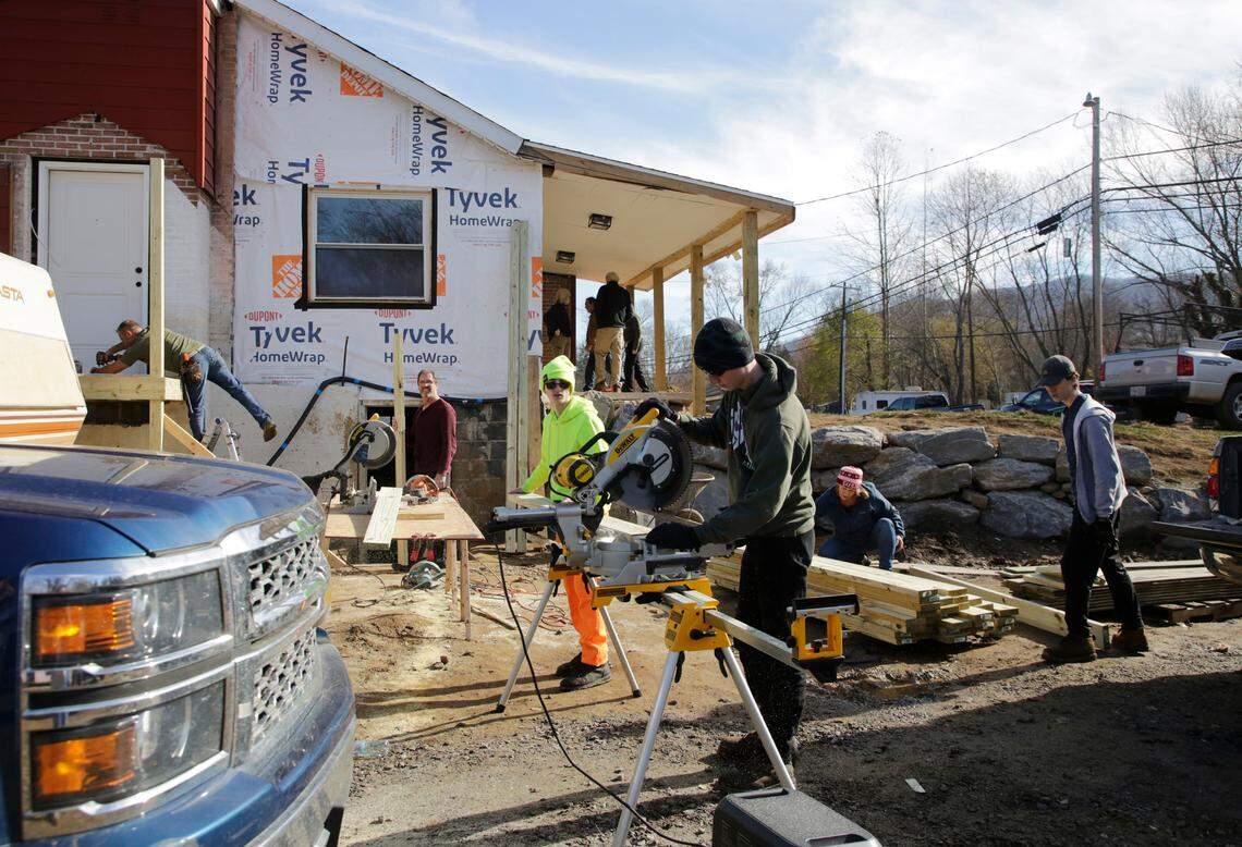 A team of volunteers work on a house in Swannanoa in late November, hoping to help a pregnant woman whose baby is expected in early December..