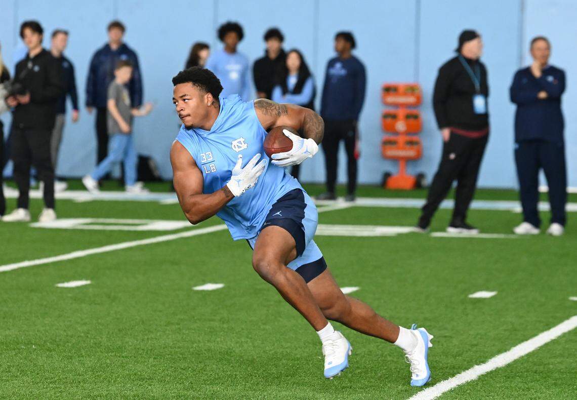 Linebacker Cedric Gray runs upfield after catching a ball during the Carolina Football Pro Day at UNC Chapel Hill’s Koman Indoor Practice Facility on Thursday, March 28, 2024.