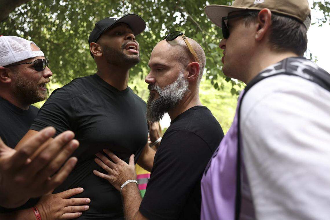 An anti abortion demonstrator and clinic escort argue at A Preferred Women’s Health Center of Charlotte on Saturday.