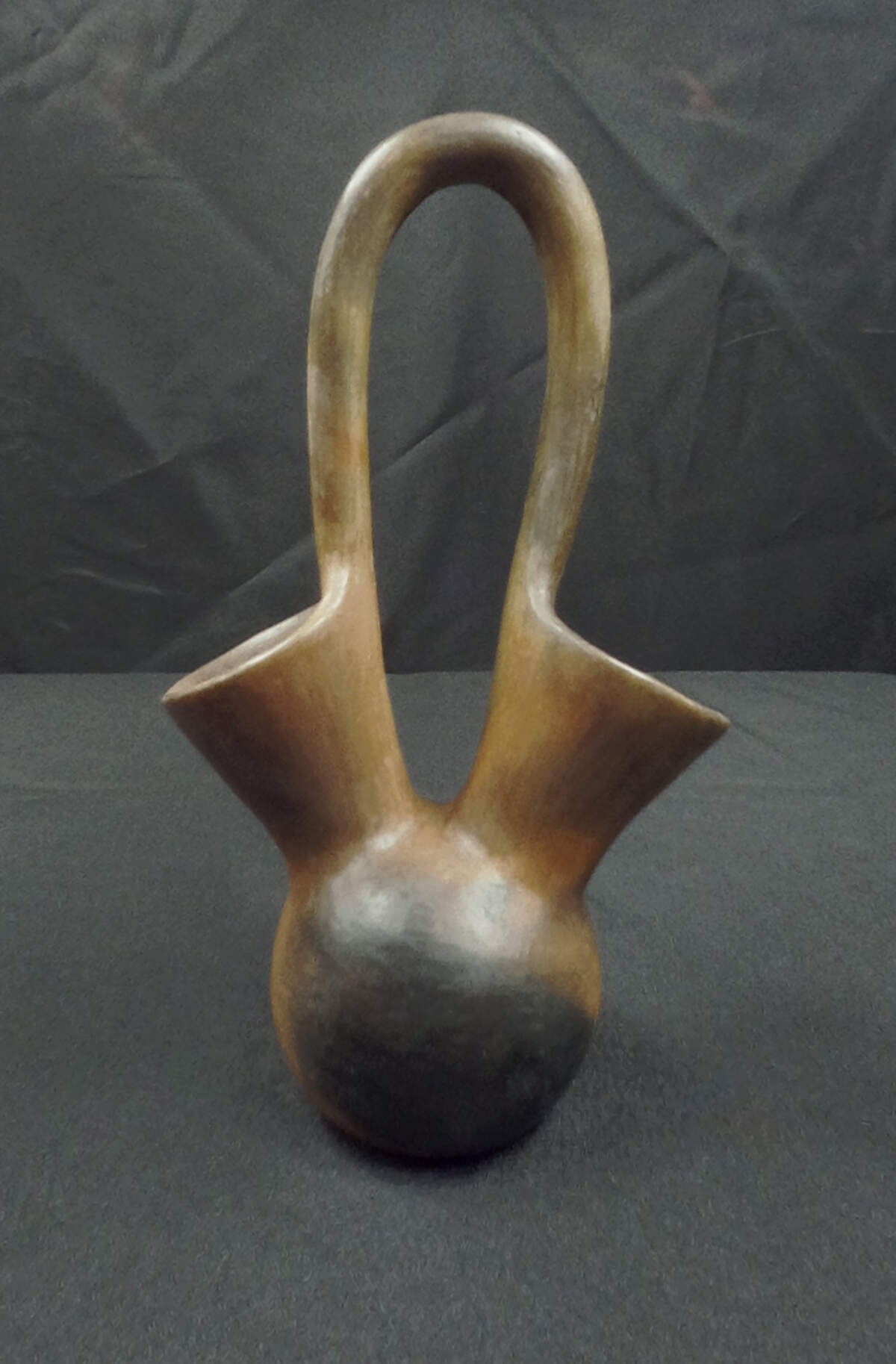 This pottery piece, titled “Wedding Jug,” is by Catawba Indian Nation artist Sally Brown. Catawba pottery is made without a glaze. Potters polish the pre-fired clay with smooth river stones.