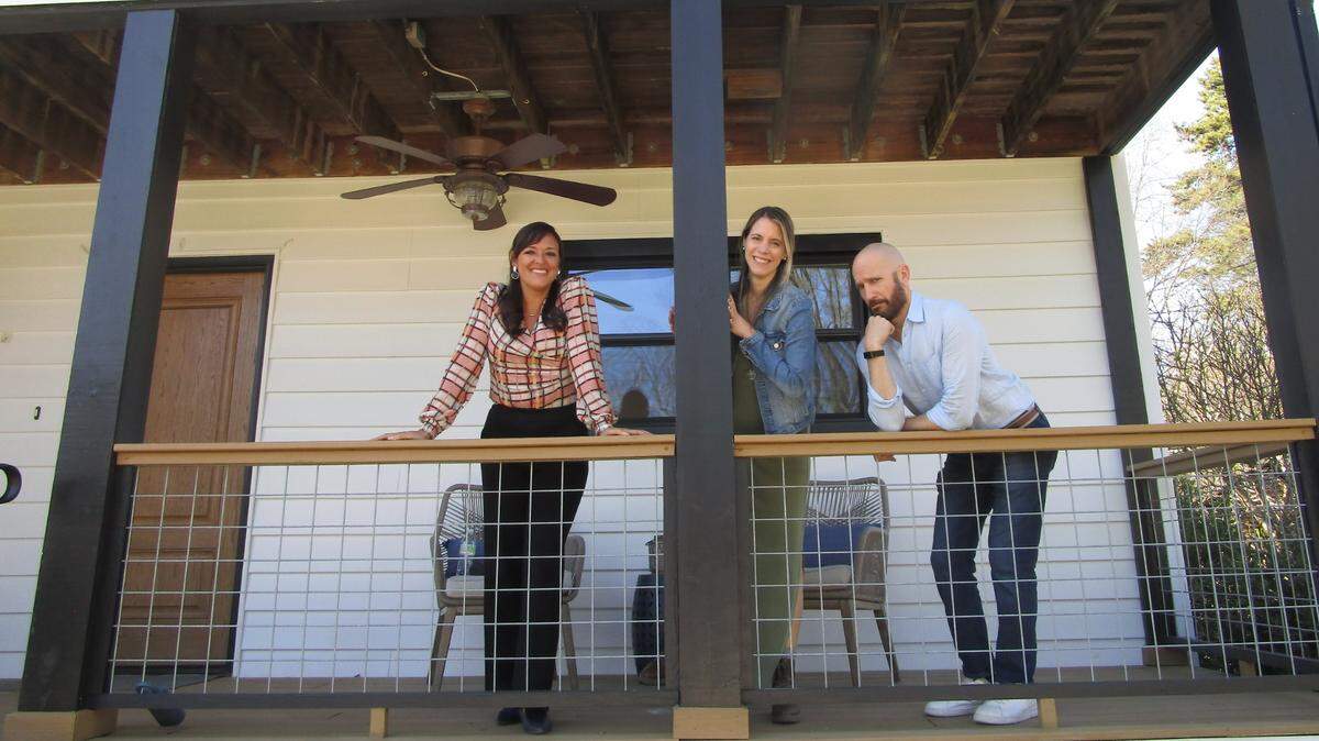 In the Charlotte, North Carolina area, buyers David and Daniela pose for a fun photo with their agent Veronica Diquez (left) during a home tour, as seen on House Hunters, Season 256.