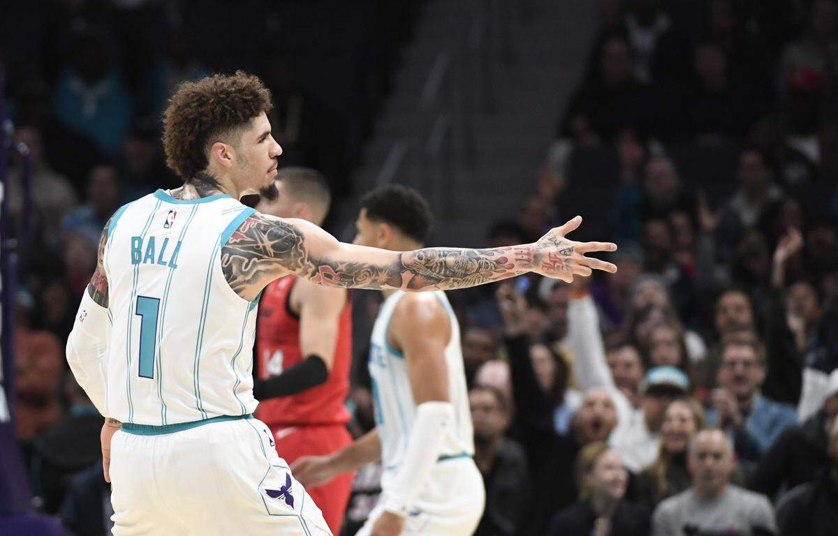 Charlotte Hornets guard LaMelo Ball (1) reacts after scoring a three point basket during the first half against the Miami Heat at the Spectrum Center.