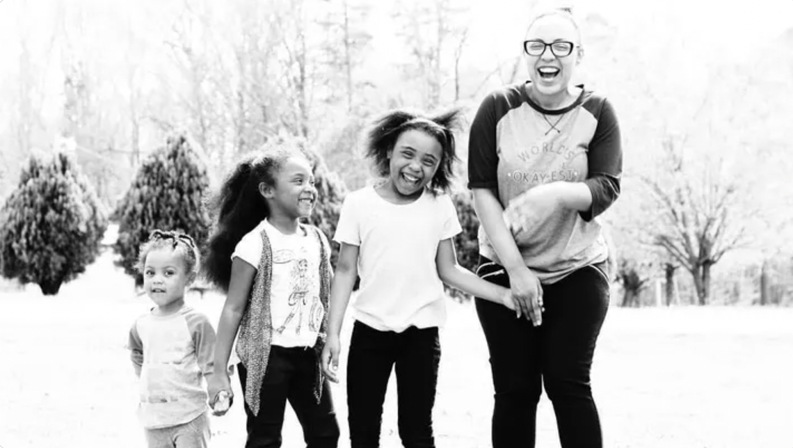 Deborah Jackson poses for a photo with her three daughters.