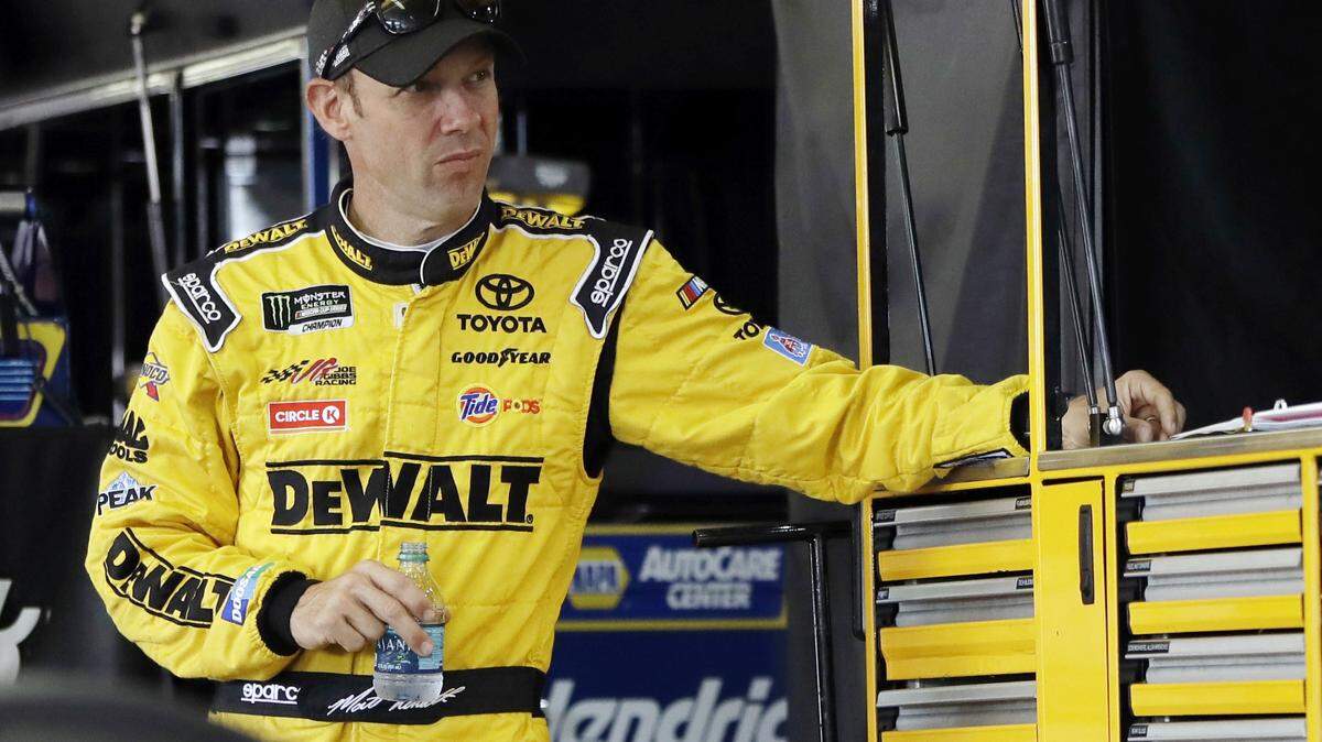FILE - In this July 29, 2017, file photo, Matt Kenseth stands in his garage stall after practice for a NASCAR Cup series auto race in Long Pond, Pa. At 48, Kenseth will be the oldest driver in the field when racing resumes. (AP Photo/Matt Slocum, File)