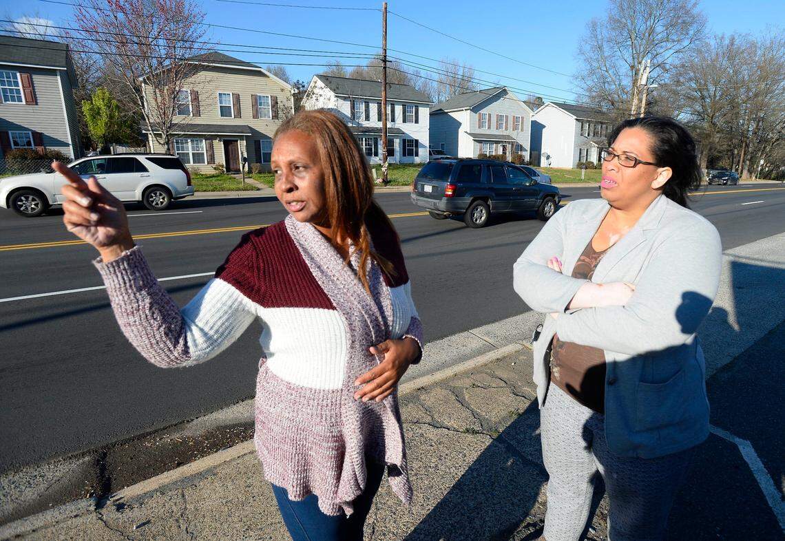 Mary Fryar, left, talks about the traffic along West Boulevard as Amy Anderson listens on March 7, 2018. Fryar lost her middle child, Ty'Asia Young, 11, who was killed while trying to cross West Boulevard after a trip to a convenience store. The boulevard has four lanes, and there is no "island" separating traffic to give pedestrians safety.