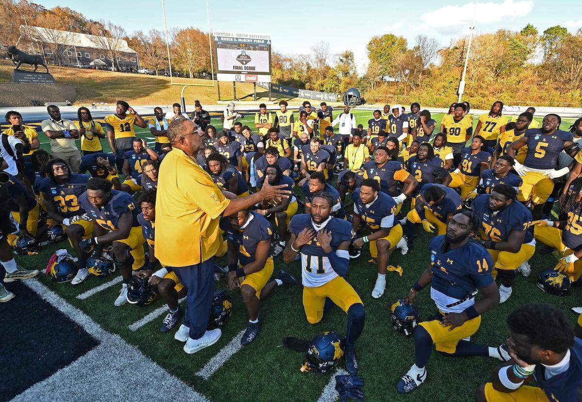 Johnson C. Smith University Golden Bulls head coach Maurice Flowers gives his team words of encouragement following the team’s 21-7 loss to Frostburg State in the opening round of the NCAA Division II playoffs at the Irwin Belk Complex in Charlotte, NC on Saturday, November 22, 2025. 