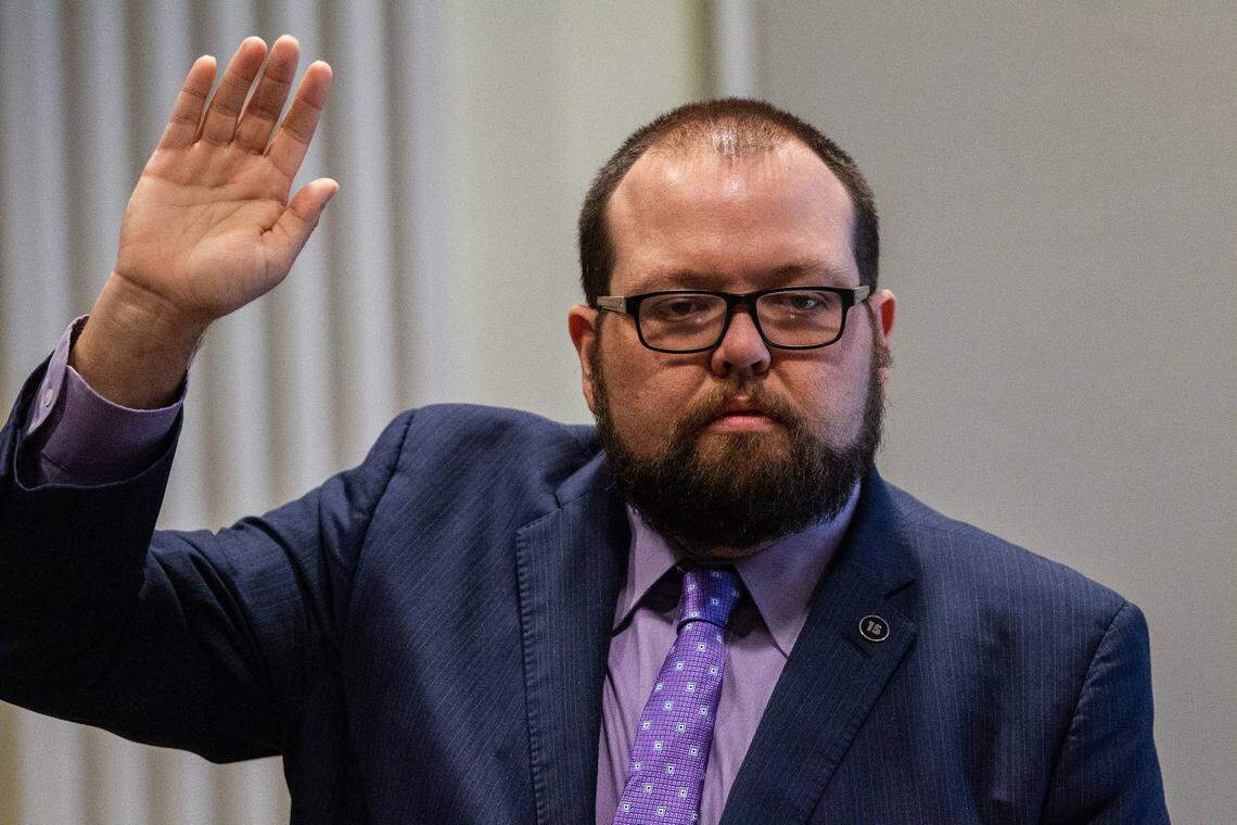 Andy Yates, a political consultant with Red Dome Group, prepares to testify under oath during the second day of a public evidentiary hearing on the 9th Congressional District voting irregularities investigation Tuesday, Feb. 19, 2019, at the North Carolina State Bar in Raleigh.