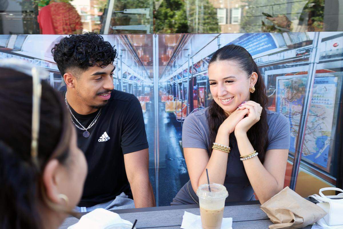 Friends Jocelyn Reyes (far left) Alex Reyes (middle), and Zully Caballero (right) share a laugh while enjoying their meal at Family Dough in Mint Hill. 