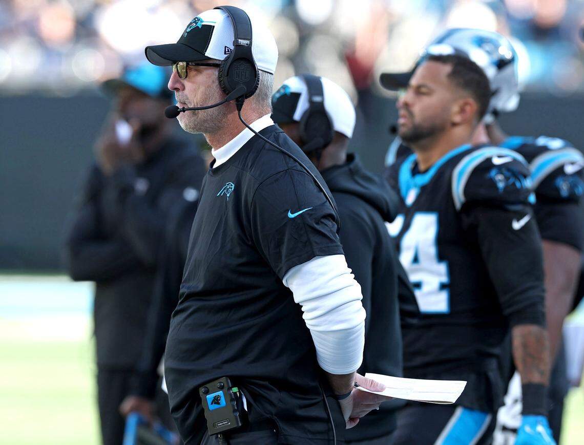 Carolina Panthers head coach Frank Reich watches the team battle the Dallas Cowboys during second-quarter action at Bank of America Stadium in Charlotte, NC on Sunday, November 19, 2023.