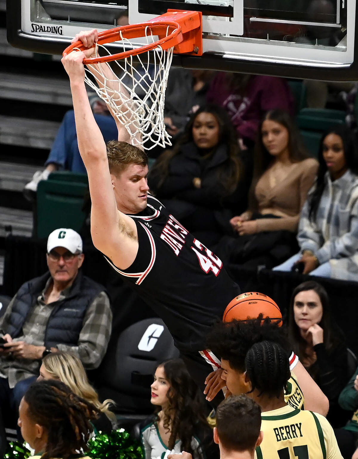 Davidson Wildcats forward David Skogman throws down a two-handed dunk during first half action against the Charlotte 49ers on Wednesday, November 29, 2023. 