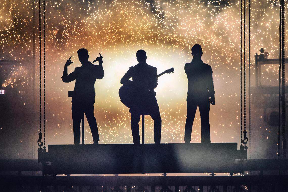 The Jonas Brothers are lowered onto the stage at the start of their concert on Wednesday night at Spectrum Center.