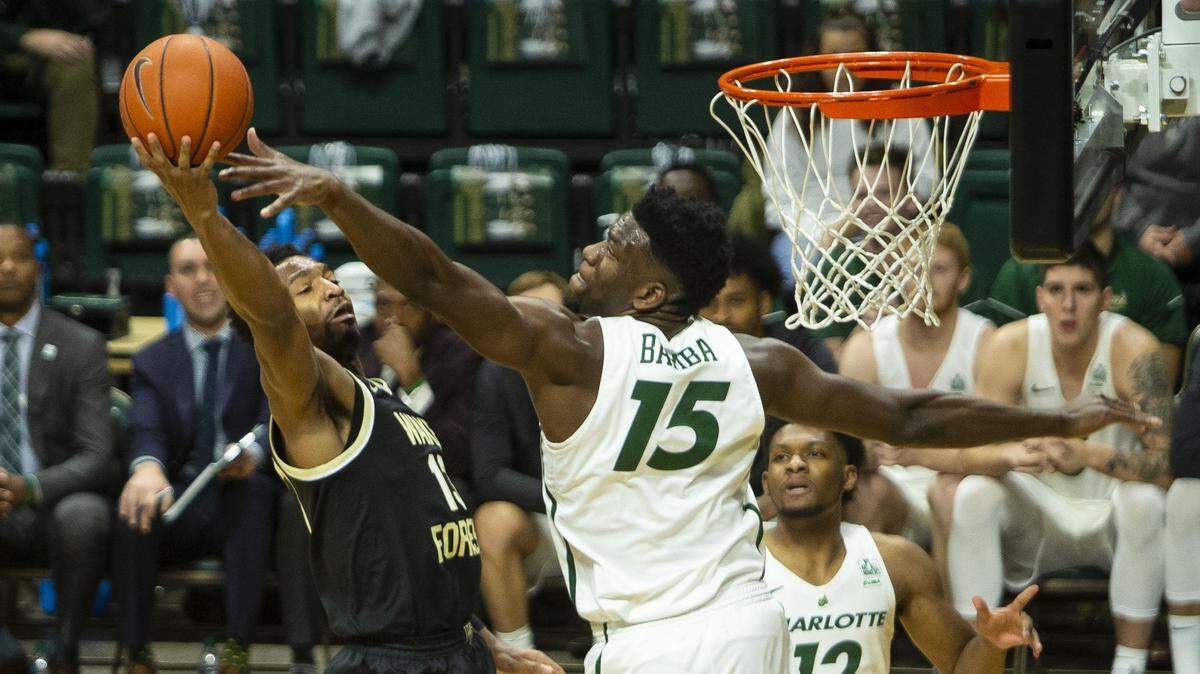 Charlotte’s Amidou Bamba (25) blocks a layup by Wake Forest’s Andrien White during a non-conference game at the Halton Arena in November.