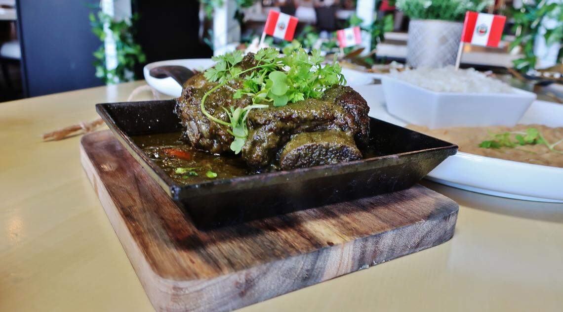 Lola’s Seco De Res Tradicional is beef short ribs slow-cooked in cilantro broth and served with canario beans, sarsa criolla and rice.