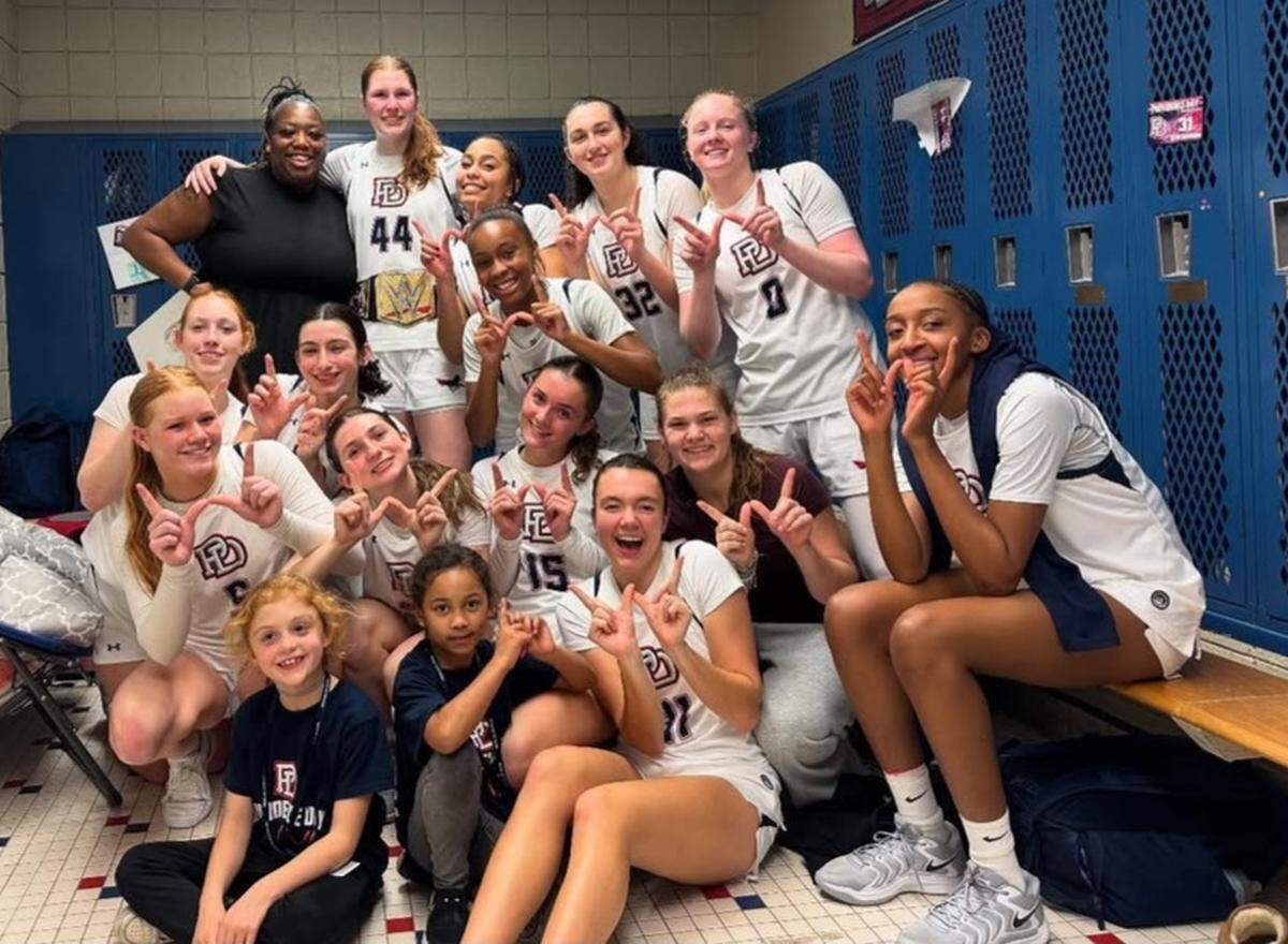 Providence Day’s girls celebrate their upset win over No. 1 Cannon School Friday night
