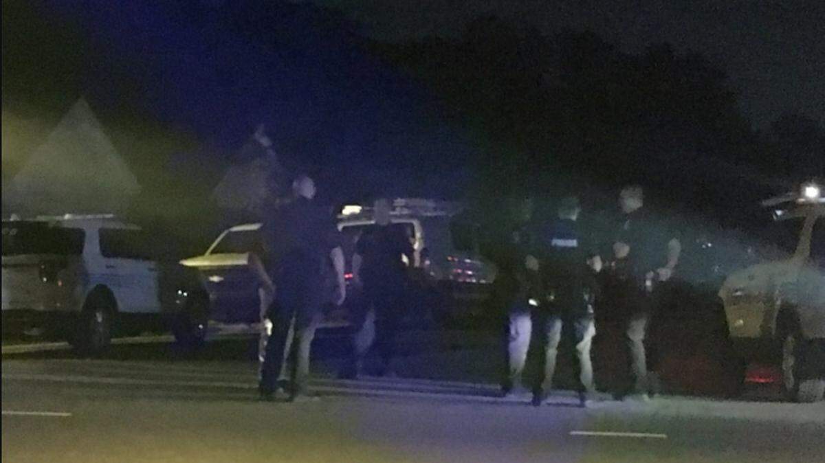 Two teenagers turned themselves in to police and are facing charges in connection to the fatal shooting of another teen in southwest Charlotte.