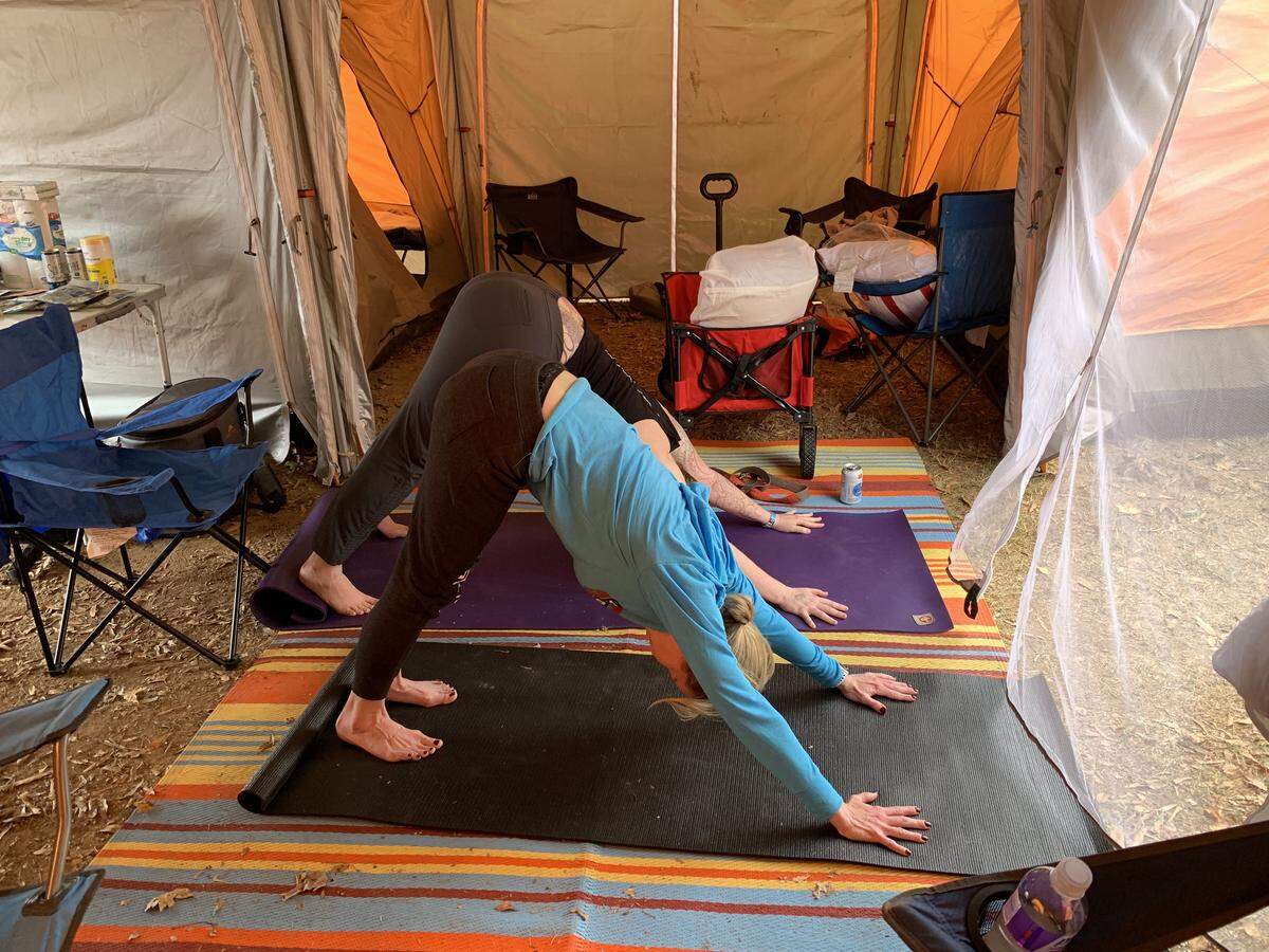 Between running legs on the trails, runners can be seen relaxing, sleeping, eating or stretching.