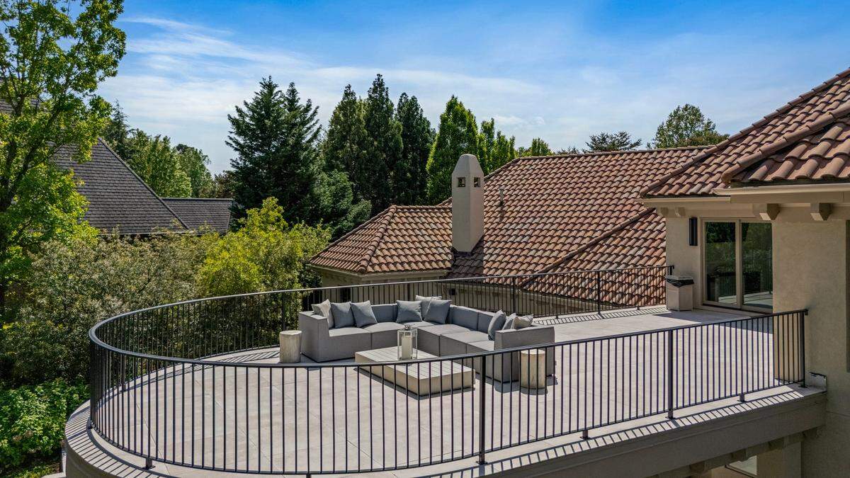 The upper level of the home includes a new rooftop terrace with panoramic water views.