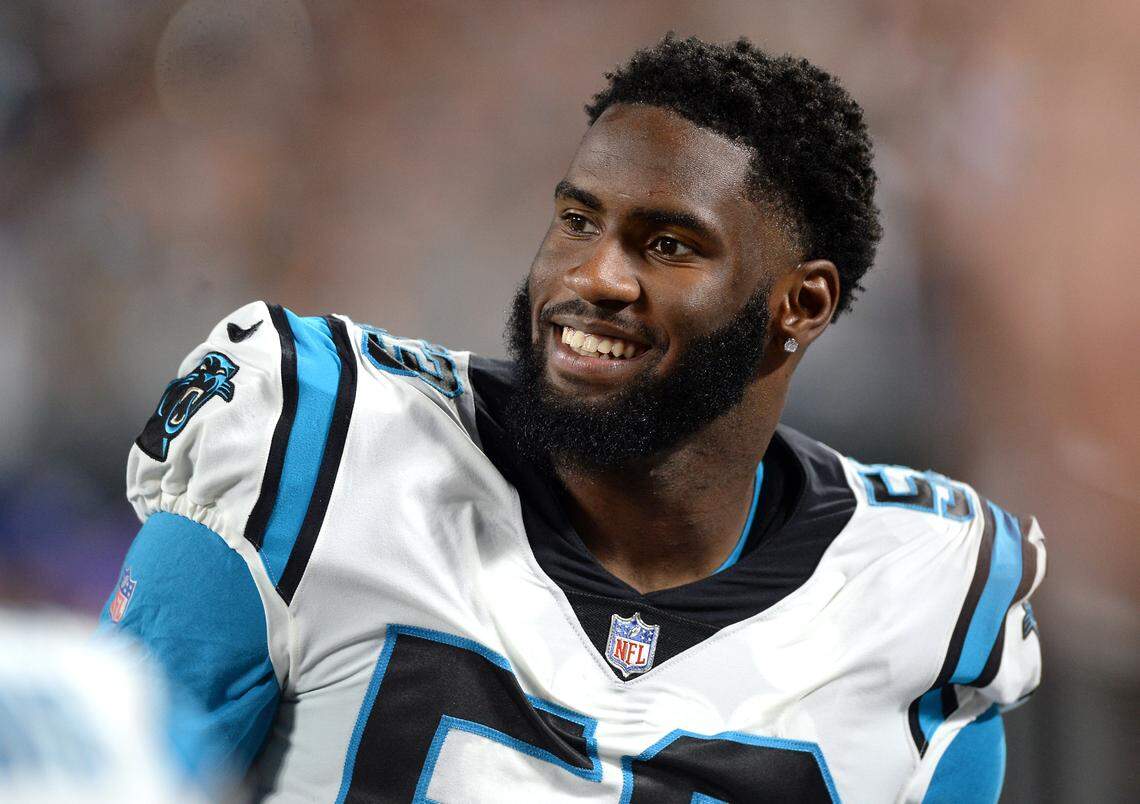 Carolina Panthers defensive end Brian Burns smiles as he stands along the team’s sideline during action against the Buffalo Bills at Bank of America Stadium in Charlotte, NC on Friday, August 26, 2022.