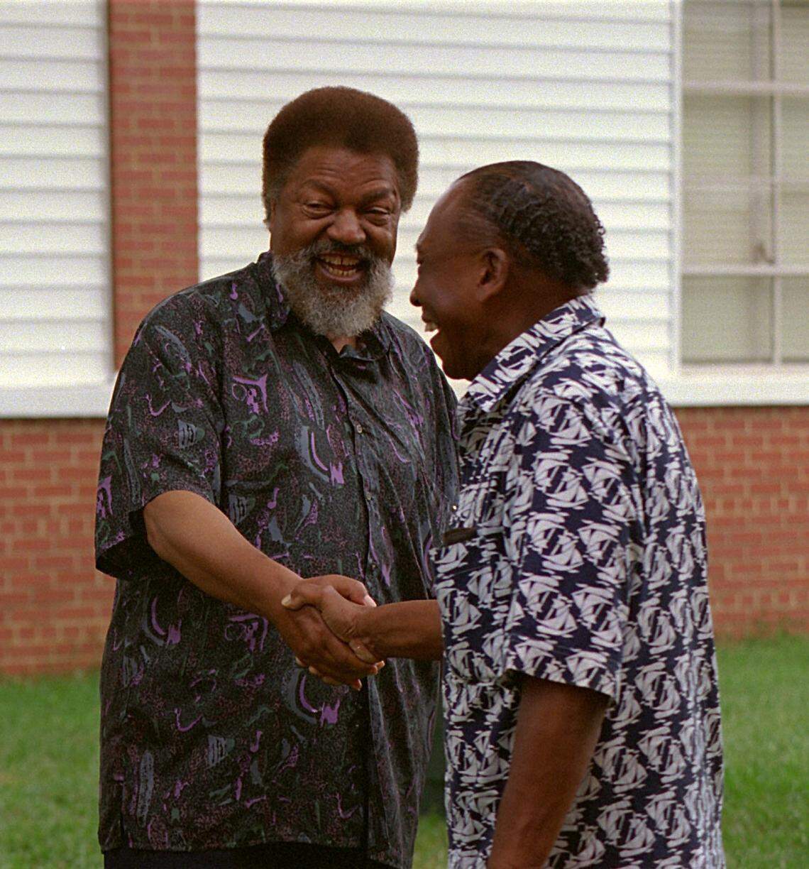 In the summer of 1995, Robert Franklin Williams and his wife Mabel returned to Monroe from Michigan to serve as grand marshals for the 10th annual Winchester Avenue High School reunion. Williams, left, was talking with Winchester grad Ernest Crawford the day of the reunion.