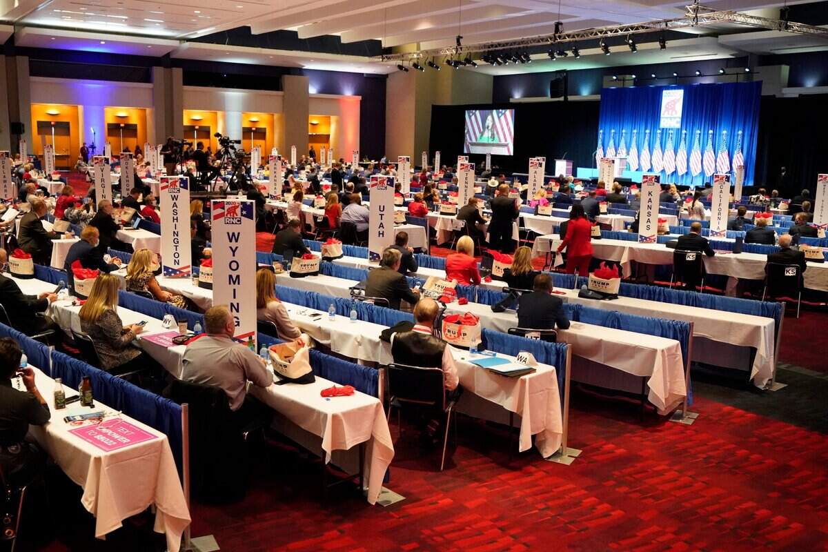 Delegates at the first day of the Republican National Convention, Monday, Aug. 24, 2020, in Charlotte, N.C. Two delegates and two support staff at the RNC tested positive for the coronavirus, Mecklenburg County officials disclosed.