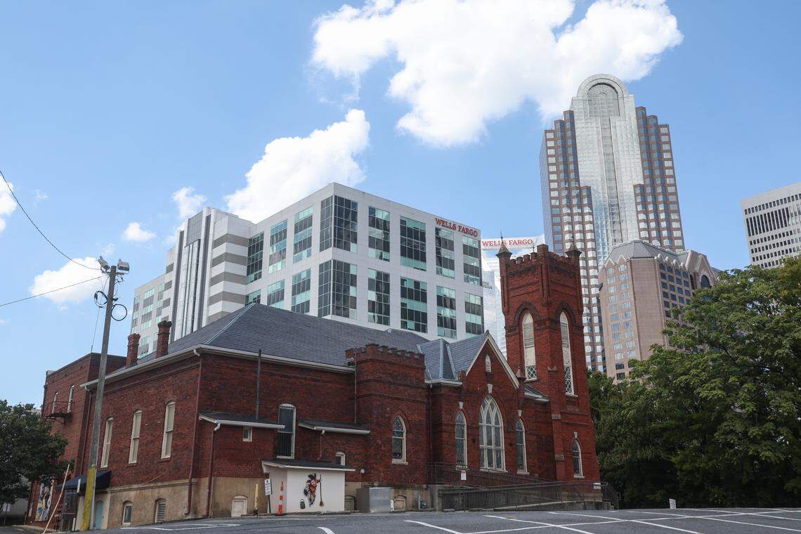 Corporate skyscrapers line the background of Grace AME Zion Church on South Brevard Street in Charlotte, NC on Friday, September 19, 2025.
