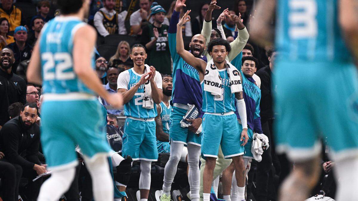 Dec 8, 2024; Indianapolis, Indiana, USA; The Charlotte Hornets bench celebrates after a play during the first half against the Indiana Pacers at Gainbridge Fieldhouse.