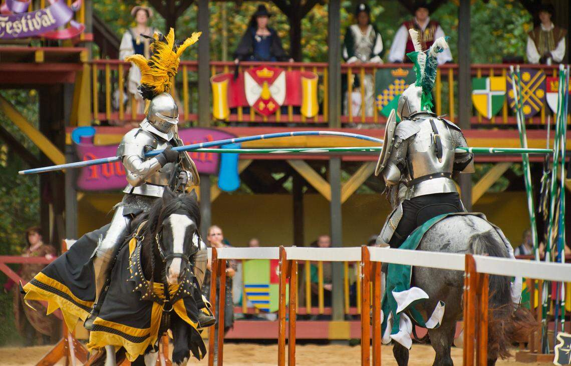 Knights battle in a joust three times daily in the Carolina Renaissance Festival’s tournament arena.