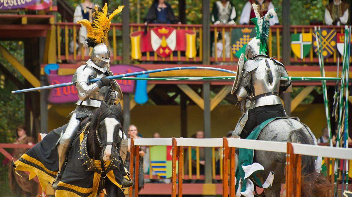 Knights battle in a joust three times daily in the Carolina Renaissance Festival’s tournament arena.
