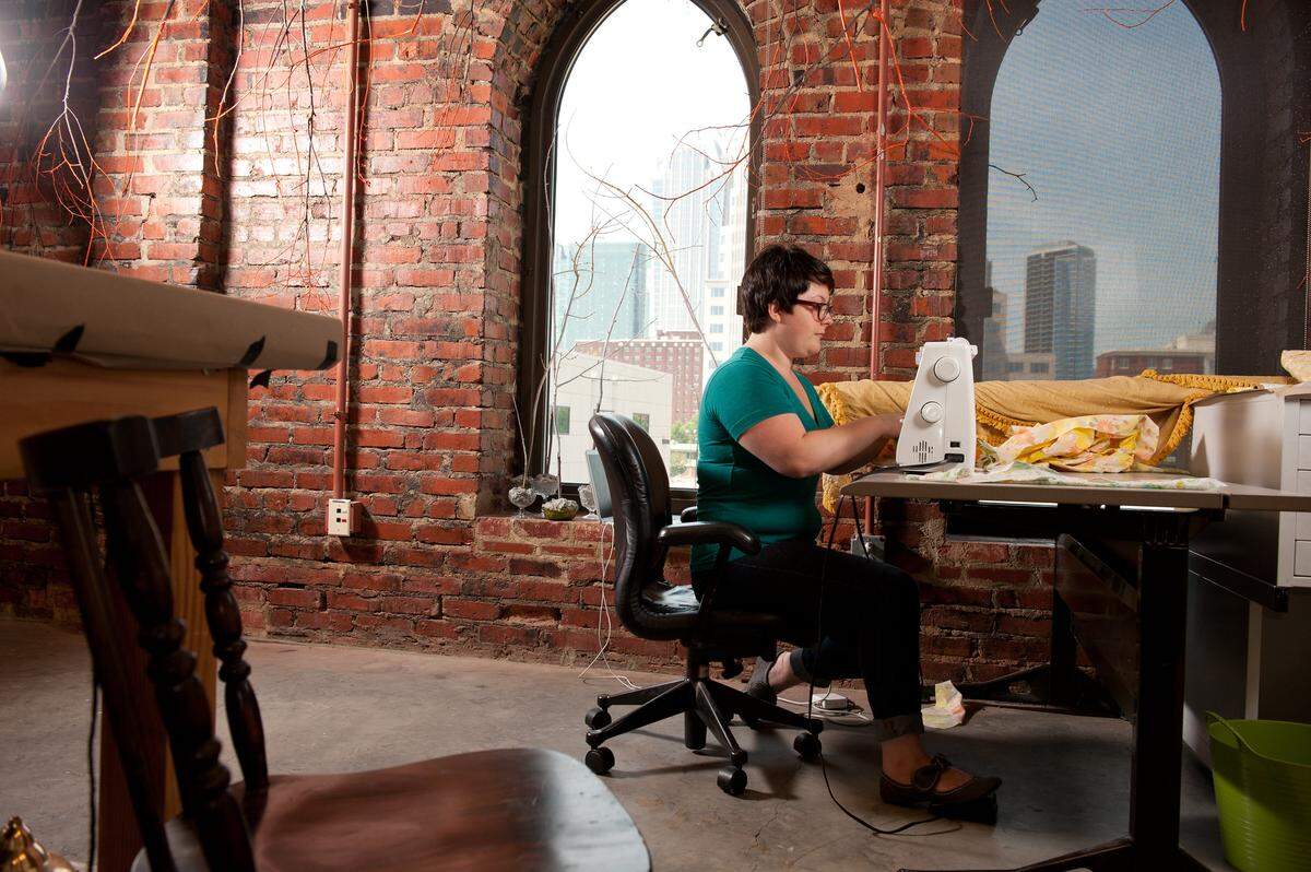 Andrea Vail, seen here in a McColl Center artist studio, will hold a workshop on creative embroidered patches on June 27 from 6-8 p.m.