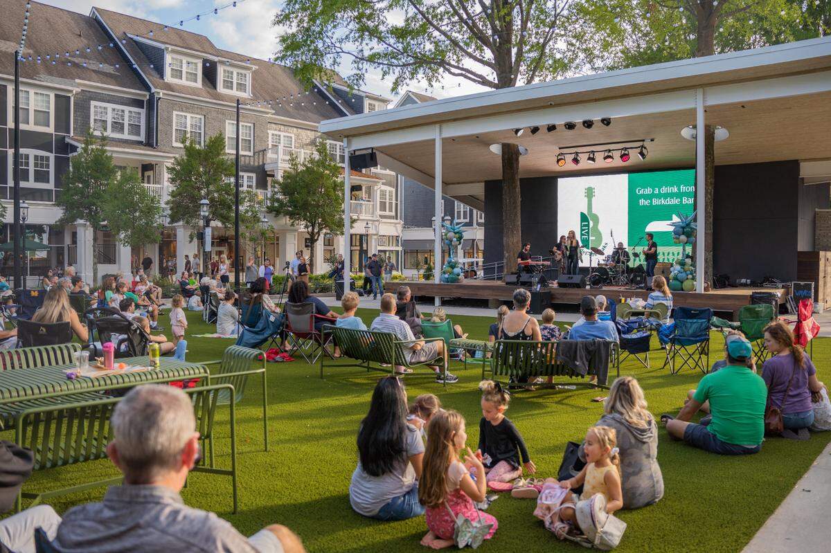 Crowds gather for a musical performance at Birkdale Village in Huntersville in this Charlotte Observer file photo.